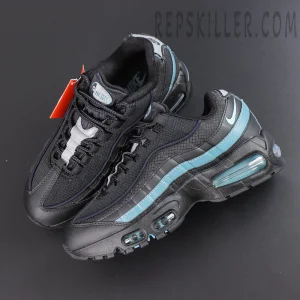 Nike Air Max 95 ‘Smokey Blue’ top angle view featuring black mesh and grid-textured layers, smoky blue wave accents, reflective details, and visible Air cushioning