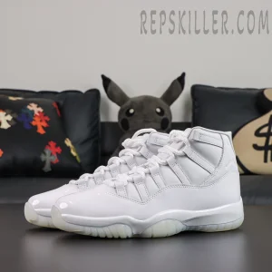 Comme des Garçons x Air Jordan 11 Retro ‘White’ front angle view featuring an all-white leather upper, glossy patent leather mudguard, white laces, and translucent outsole
