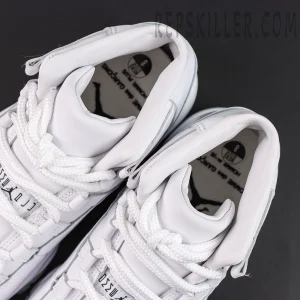Comme des Garçons x Air Jordan 11 Retro ‘White’ collar and interior close-up featuring padded white collars, thick white laces, and collaboration insole graphics