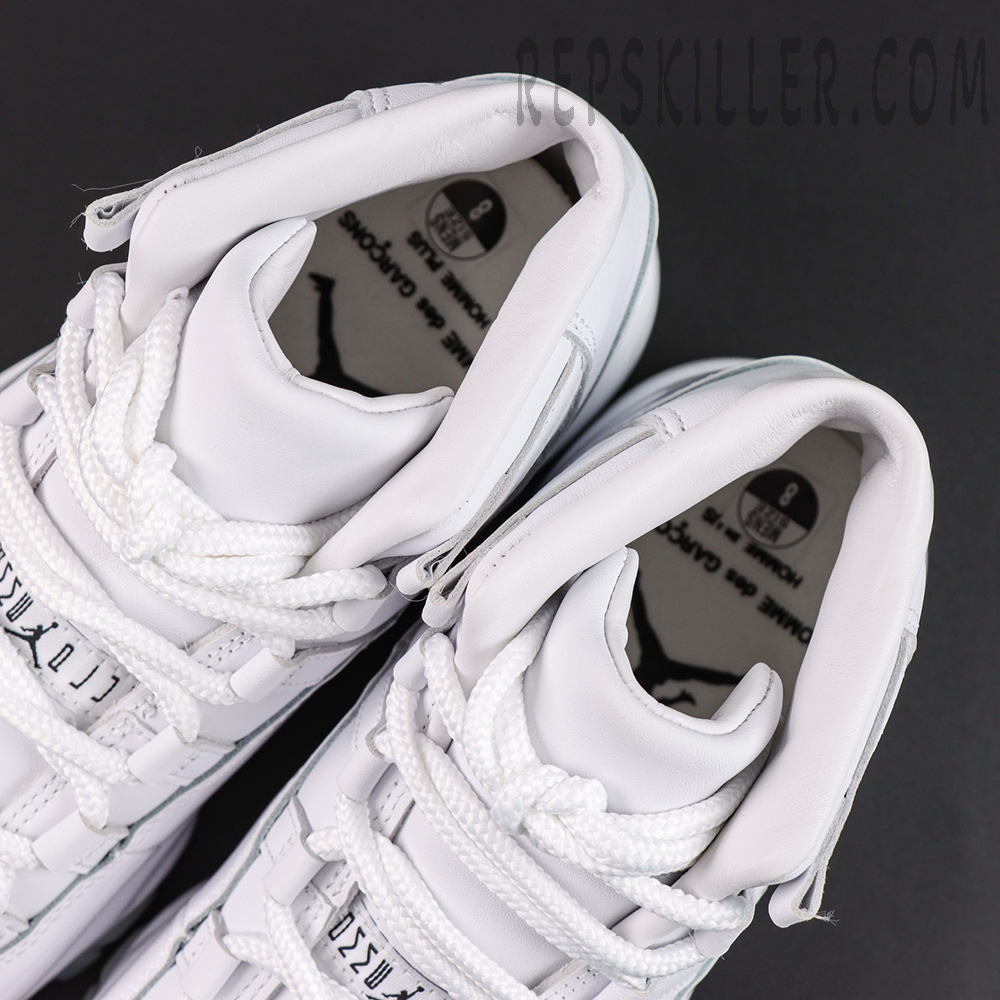 Comme des Garçons x Air Jordan 11 Retro ‘White’ collar and interior close-up featuring padded white collars, thick white laces, and collaboration insole graphics