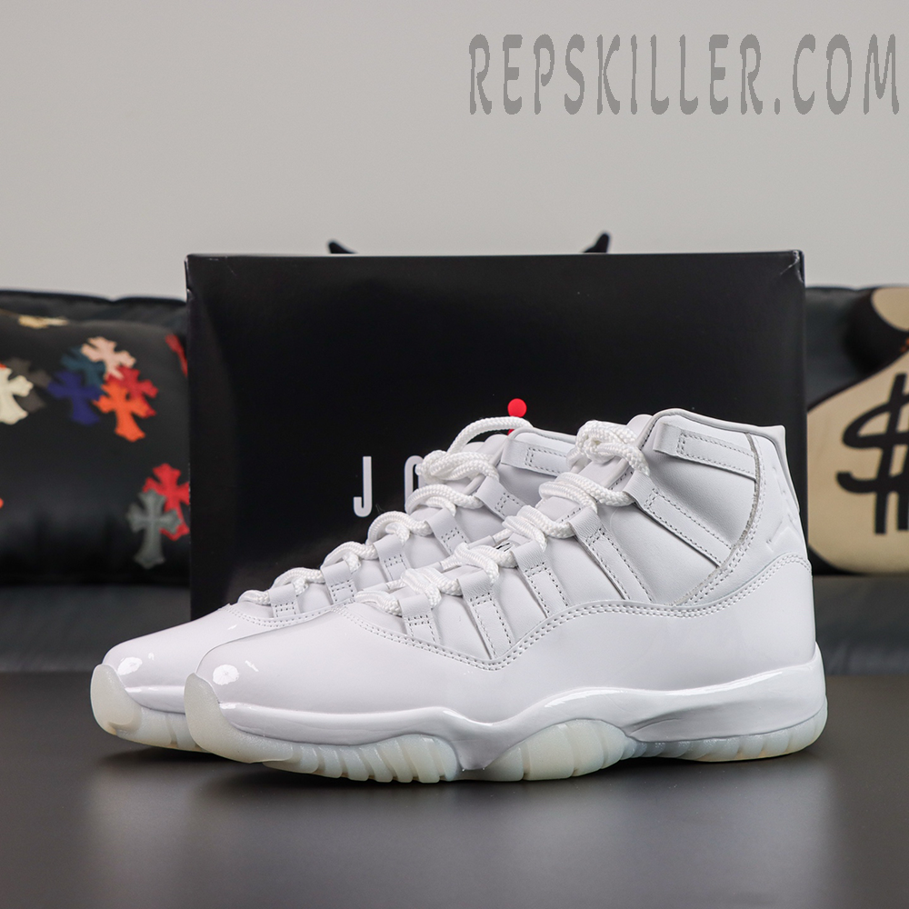 Comme des Garçons x Air Jordan 11 Retro ‘White’ pair with black Jordan shoebox featuring an all-white high-top upper, glossy patent leather, and translucent icy outsole