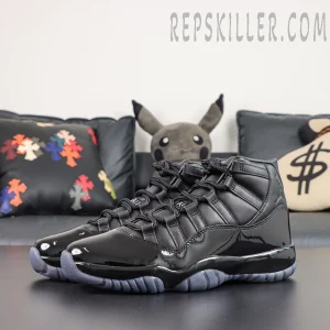 Comme des Garçons x Air Jordan 11 Retro ‘Black’ pair in front angle view featuring an all-black leather upper, glossy patent leather toe, and icy grey translucent outsole