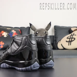 Comme des Garçons x Air Jordan 11 Retro ‘Black’ rear angle close-up highlighting the leather collar, embossed Jumpman, collaboration text, patent leather heel, and icy grey outsole