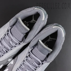 Air Jordan 14 Retro ‘Flint Grey’ tongue and interior close-up featuring grey laces, perforated tongues, metallic tongue details, and Jumpman insole graphics