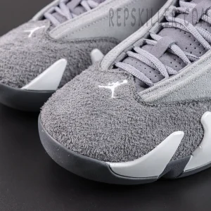 Air Jordan 14 Retro ‘Flint Grey’ toe box close-up featuring dark grey hairy suede texture, white Jumpman embroidery, grey laces, and metallic silver midsole accents