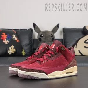 Air Jordan 3 Retro ‘Bin23’ front angled pair view featuring a burgundy colorway, metallic eyelets, elephant print accents and classic AJ3 construction
