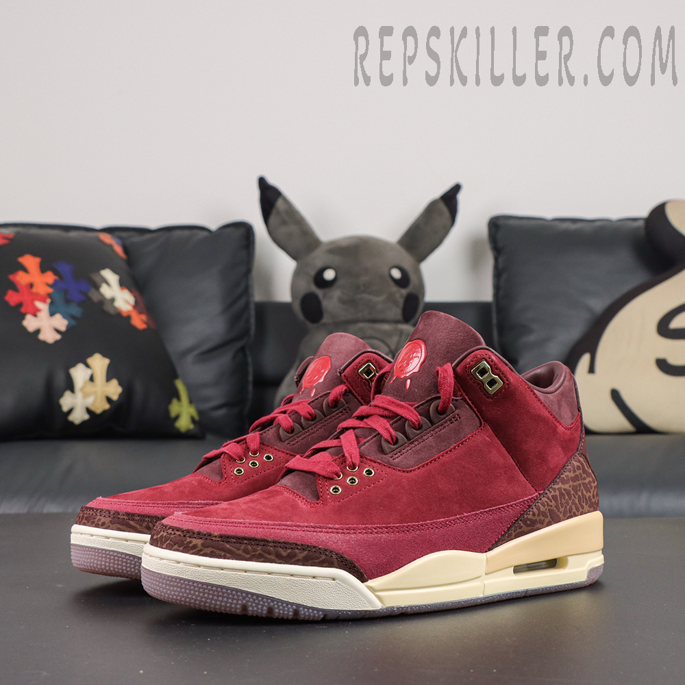 Air Jordan 3 Retro ‘Bin23’ front angled pair view featuring a burgundy colorway, metallic eyelets, elephant print accents and classic AJ3 construction