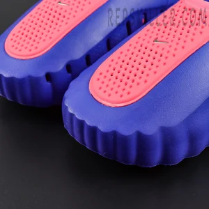 Nike Mind 001 AMP ‘Indigo Burst’ vamp close-up highlighting the bright red perforated panel, metallic mini Swoosh, and indigo molded foam construction