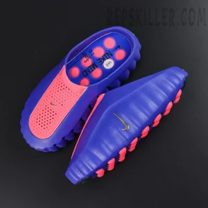 Nike Mind 001 AMP ‘Indigo Burst’ top angle view featuring bright red perforated vamps, indigo uppers, silver Swoosh branding, and red outsole nodes