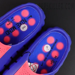 Nike Mind 001 AMP ‘Indigo Burst’ interior close-up featuring blue footbeds, red circular node graphics, Nike Mind branding, and size labels