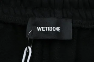 We11done Distressed 11 Logo Printed Wide Leg Pants Brand label
