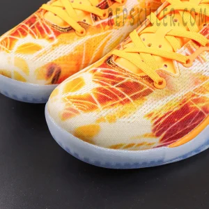 Kobe 8 ‘Shanghai Firework Spark’ toe close-up featuring an engineered mesh upper with orange, yellow and red firework graphics, bright orange laces, and an icy translucent outsole