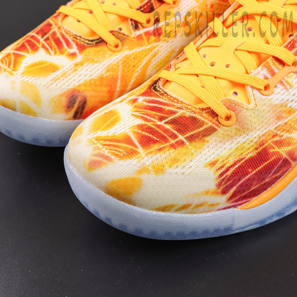 Kobe 8 ‘Shanghai Firework Spark’ toe close-up featuring an engineered mesh upper with orange, yellow and red firework graphics, bright orange laces, and an icy translucent outsole