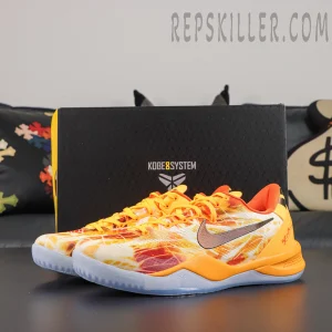 Kobe 8 ‘Shanghai Firework Spark’ pair displayed with a Kobe System shoebox, featuring orange and yellow firework graphics, dark Swoosh branding, orange heel support, and an icy outsole