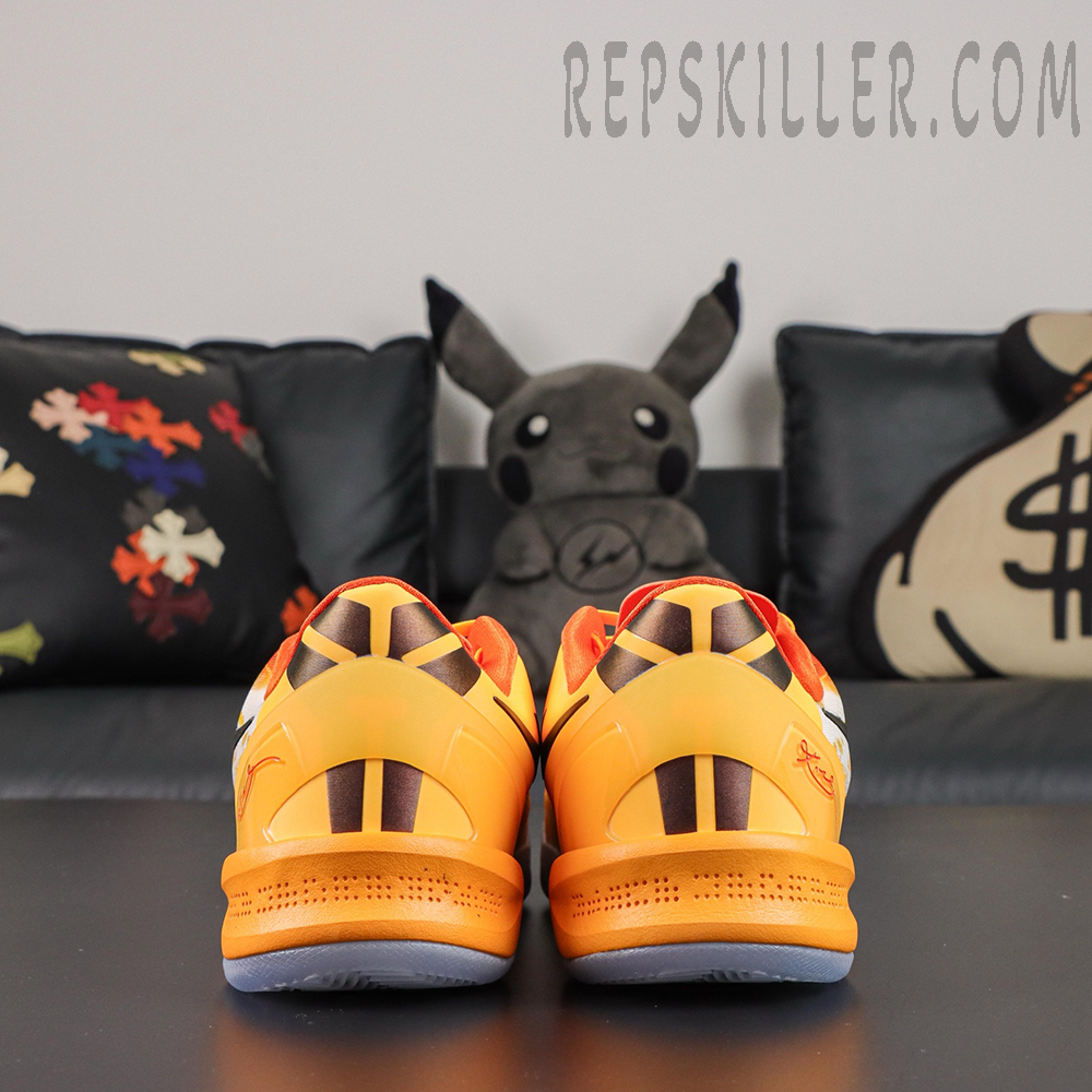 Kobe 8 ‘Shanghai Firework Spark’ rear view featuring orange heel counters, black striped graphics, red Kobe signature details, and translucent icy blue outsoles