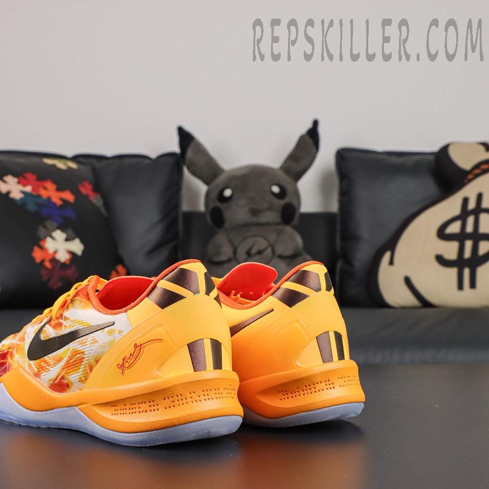 Kobe 8 ‘Shanghai Firework Spark’ rear angle view highlighting the orange heel structure, black stripe details, red Kobe signature, and translucent icy blue outsole