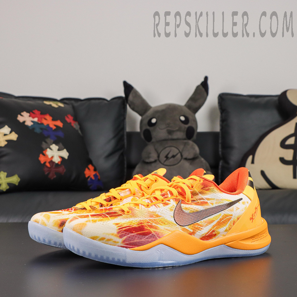 Kobe 8 ‘Shanghai Firework Spark’ pair in front angle view featuring bright orange laces, firework-print uppers, dark Swoosh branding, orange midsoles, and icy blue outsoles