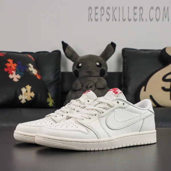 Air Jordan 1 Retro Low OG Sail 2026 sneakers featuring a clean monochromatic leather design, perforated toe boxes, and University Red Nike Air tongue branding.